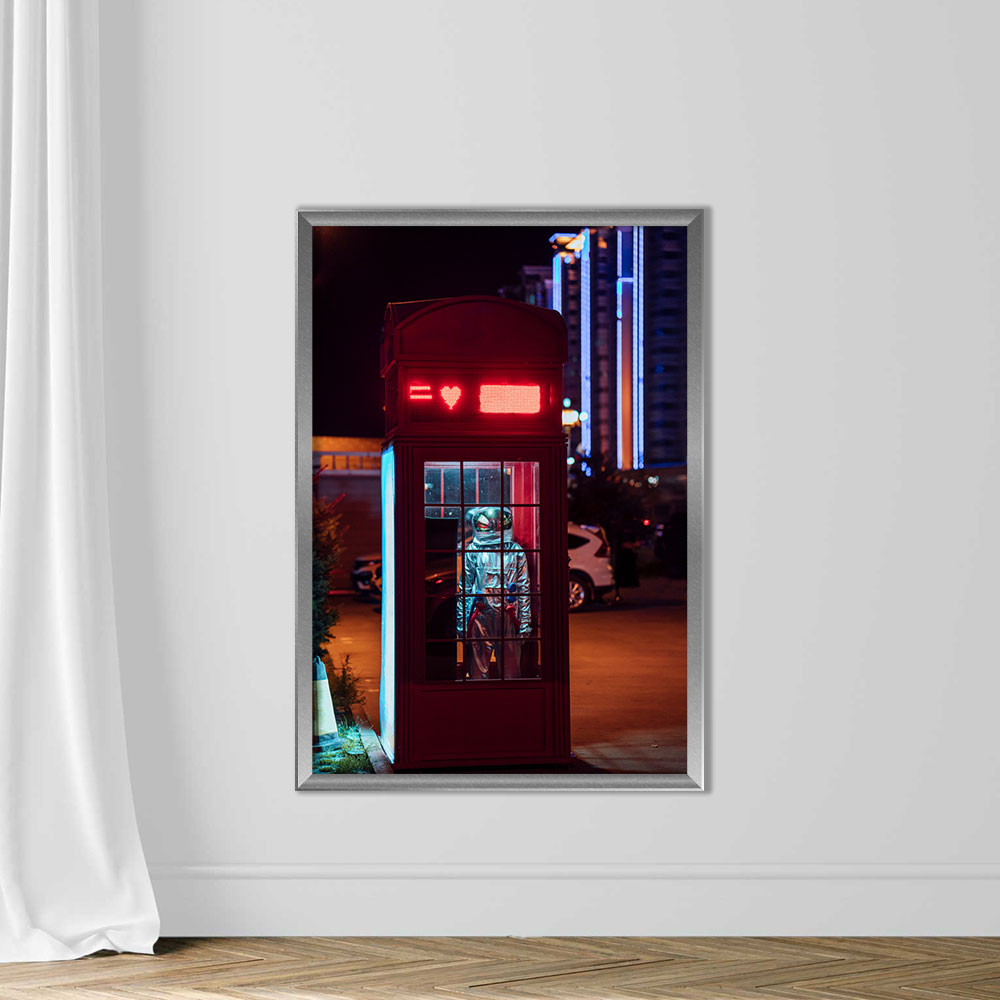 Spaceman standing in a telephone box at night - Image 4
