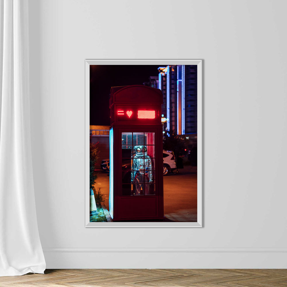 Spaceman standing in a telephone box at night - Image 2