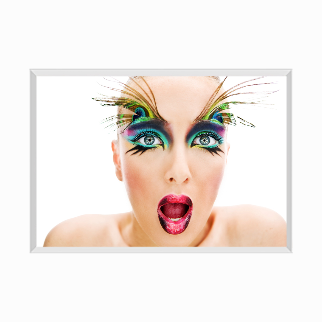 Young Woman Wearing Make-Up and Peacock Feathers on Eyebrows