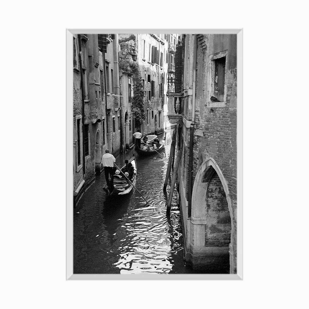 Gondolas in Canal Amid Buildings