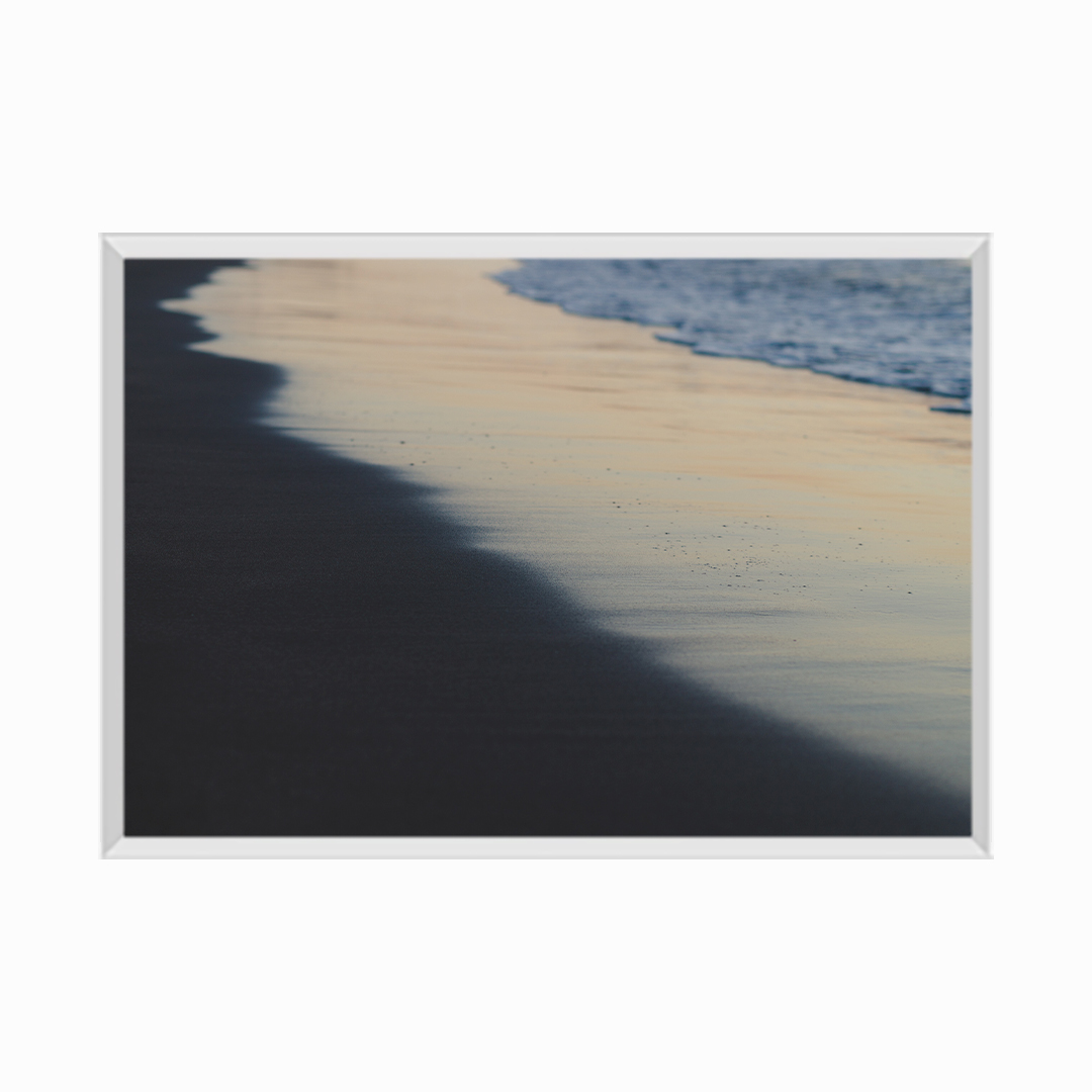 Blurred background of waves and black sand beach