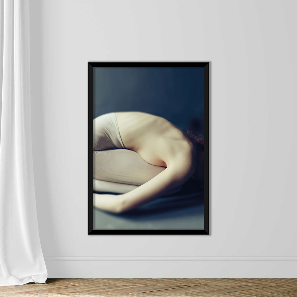 Woman curled up in the fetal position - Image 3