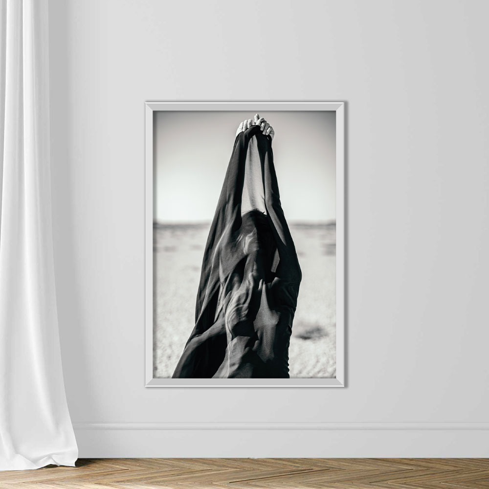 Artistic abstract portrait of woman covered with black fabric in desert - Image 2